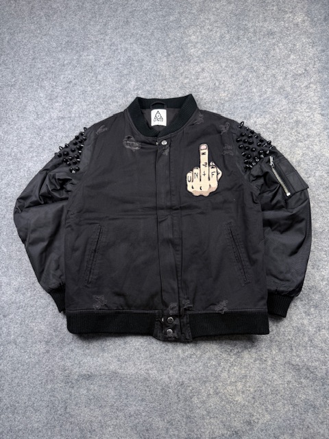 UNIF Grunge Spike-Studded Shoulder Bomber Jacket with Graphic Patch - Jet Black | Size M/L UNIF Grunge Spike-Studded Shoulder Bomber Jacket with Graphic Patch - Jet Black | Size M/L
